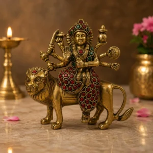 brass durga idol on lion